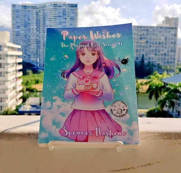 Picture of Paper Wishes book on a balcony overlooking Waikiki